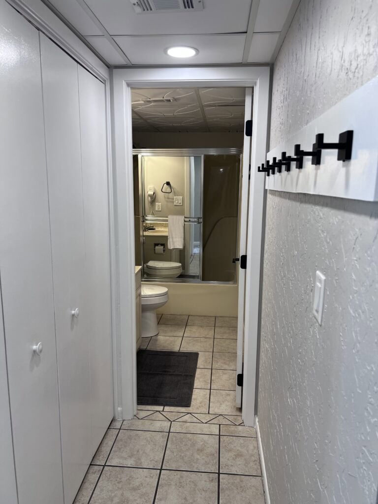 Clean bathroom with shower and toilet at Edgewater Beach Resort.